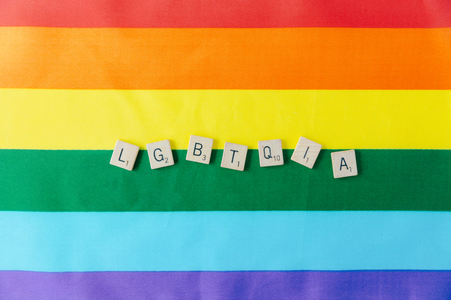 What does LGBTQIA+ stand for — letters on a rainbow pride flag