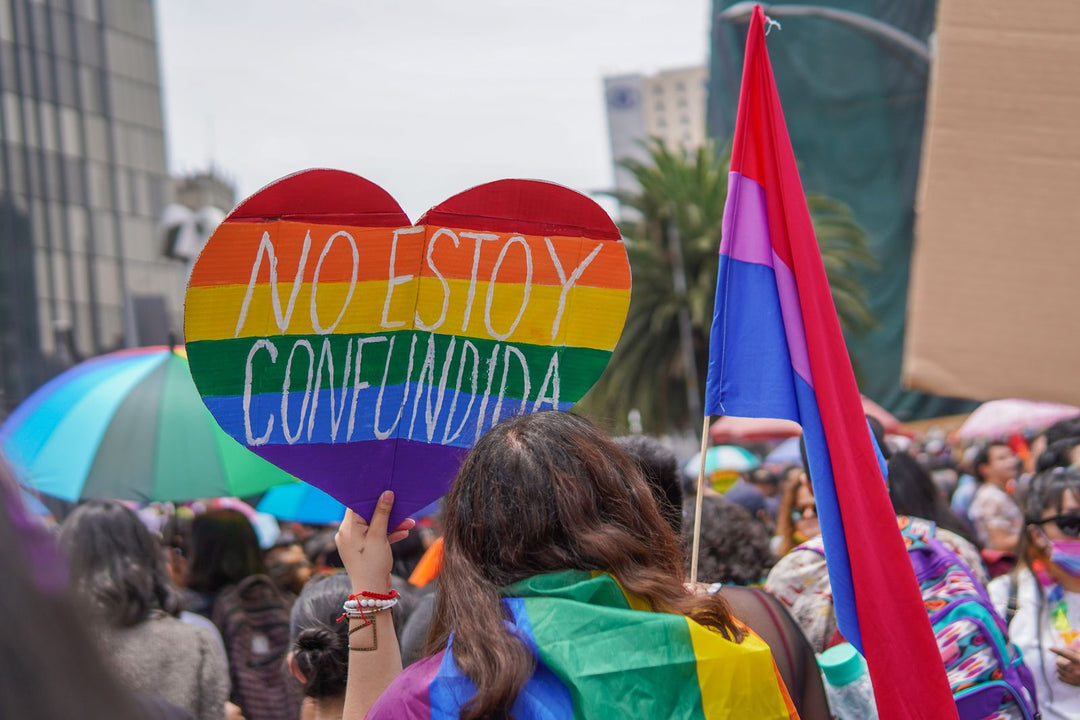 Bisexual flag meaning — a bisexual pride flag flying at a Pride parade